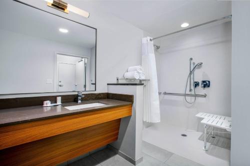 a bathroom with a sink and a shower at Fairfield by Marriott Inn & Suites Harrisburg West/Mechanicsburg in Mechanicsburg