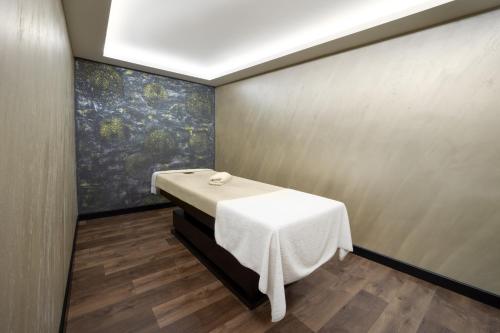 a room with a table and a painting on the wall at Pianoforte by Febor Hotels&Spa in Istanbul