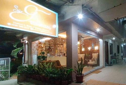 a store front with a large sign in front of it at RedDoorz at Sir G Hotel D'Mall Boracay in Boracay