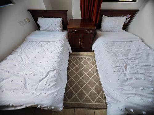 En eller flere senge i et værelse på The Cove Tudor