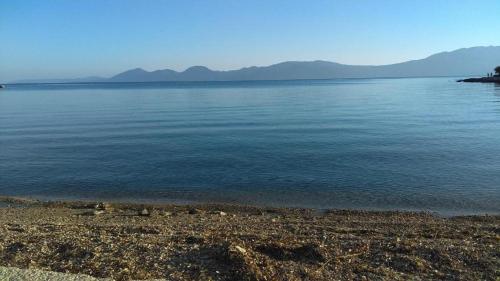 a large body of water with mountains in the background at Studio apartment in Sucuraj with sea view, balcony, air conditioning, WiFi 3560-4 in Sućuraj