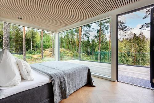 Кровать или кровати в номере Villa Padel - Premium Lakeside Residence & Grounds