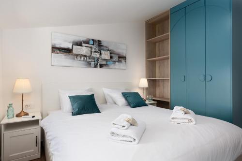 a bedroom with two beds with towels on them at Casa Histria in Motovun