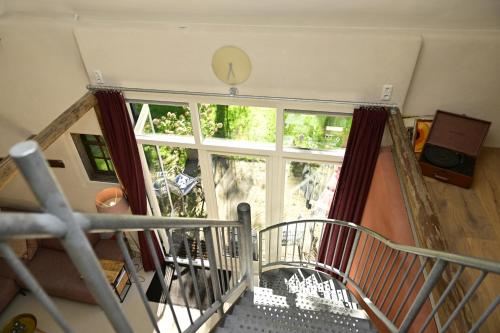 an overhead view of a room with a large window at Landgoedhoeve Vosbergen in Heerde