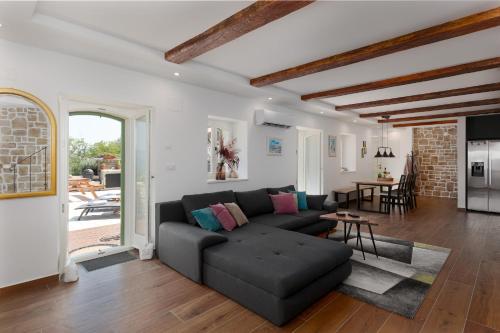 a living room with a couch and a table at Casa Histria in Motovun