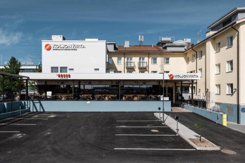 a parking lot in front of a building at Original Sokos Hotel Koljonvirta in Iisalmi