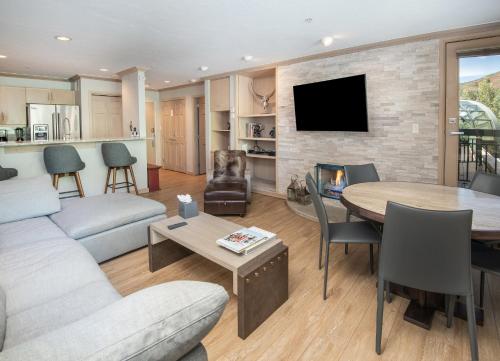a living room with a couch and a table at Gateway Plaza R4 Condo in Vail