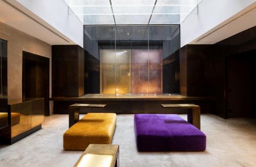 A seating area at STRAF, Milan, a Member of Design Hotels