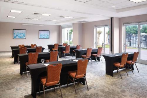 a conference room with a long table and chairs at Hilton Garden Inn Houston/Bush Intercontinental Airport in Houston