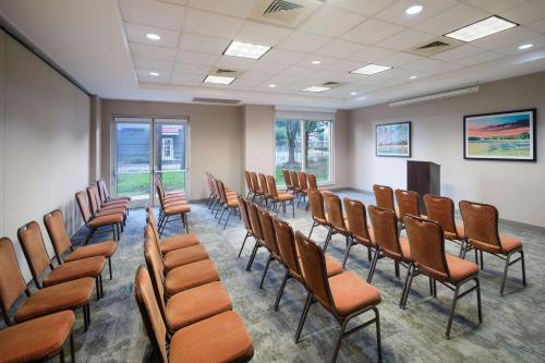 a conference room with chairs and a podium in it at Hilton Garden Inn Houston/Bush Intercontinental Airport in Houston