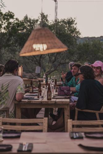a group of people sitting at a table at Aguamadera in Santa Eularia des Riu
