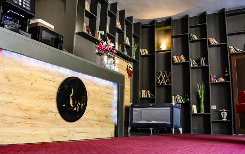 a room with a wall with a wooden door at R34 Boutique Guest House in Veliko Tŭrnovo
