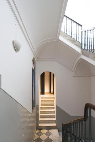 a staircase in a house with a white ceiling at FilHome 44 in Catania