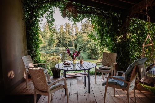 a patio with a table and chairs and a view at Cottage house Lublin in Lublin