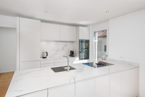 Kuchyň nebo kuchyňský kout v ubytování Neubauwohnung mit Lift in Matten