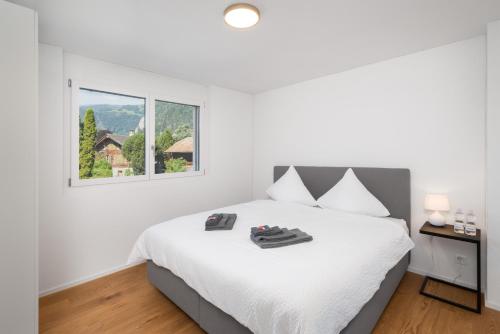 Postel nebo postele na pokoji v ubytování Neubauwohnung mit Lift in Matten