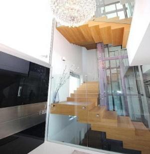 a view of a staircase through a glass window at Roig Sapphire ***** in Chamonix