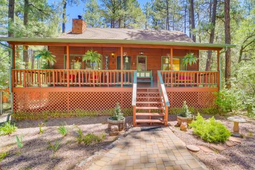 a home with a wrap around porch with a deck at Hikers Haven Pine Getaway with Wraparound Deck! in Pine