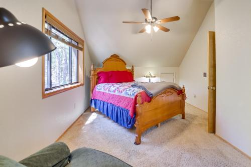 a bedroom with a bed and a ceiling fan at Hikers Haven Pine Getaway with Wraparound Deck! in Pine