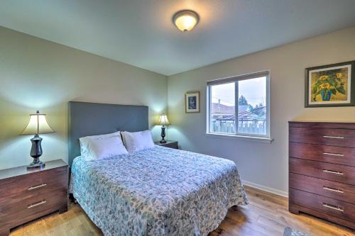 a bedroom with a bed and a window at Anacortes Condo - Walk to Town, Marina, and Bay! in Anacortes