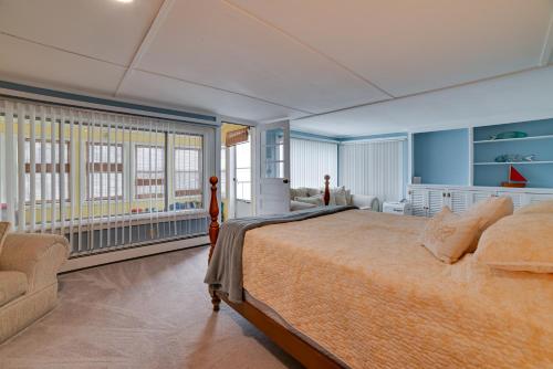 a bedroom with a large bed and a couch at Cayuga Lake Retreat in Seneca Falls with Dock! in Seneca Falls