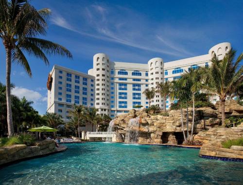 a resort with a swimming pool and a water slide at Seminole Hard Rock Hotel & Casino Hollywood in Fort Lauderdale