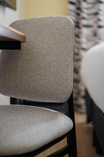 a chair sitting at a table in a room at Hôtel Riesner in Paris