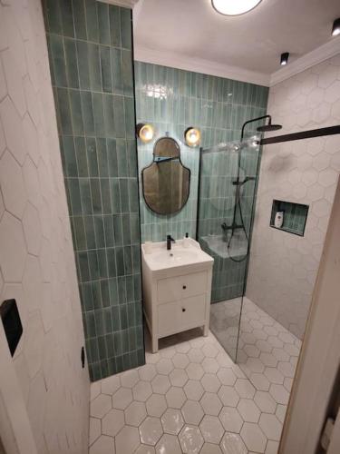 a bathroom with a sink and a shower at Nookbed in Budapest