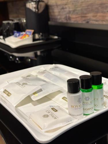 a table with three bottles of cosmetics on it at ROYAL ACE LUXUR in Bengaluru