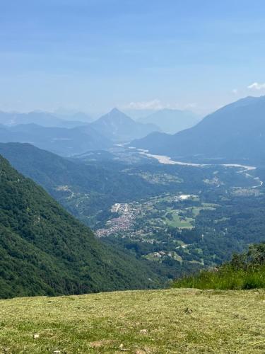 a view of a valley from a grassy hill at Casa Pura in Ampezzo