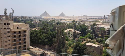 a view of the pyramids from a building in the city at pyramids grand museum inn in Cairo