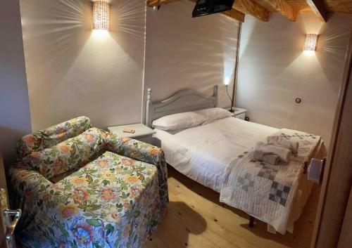 Ένα ή περισσότερα κρεβάτια σε δωμάτιο στο Casa El Nogal