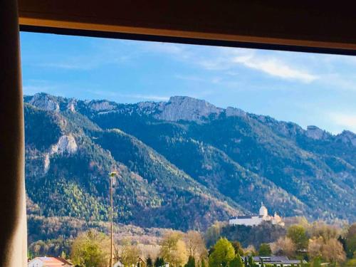 a view of a mountain range from a window at KampenZeit Loft mit traumhaftem Panoramablick in Aschau im Chiemgau