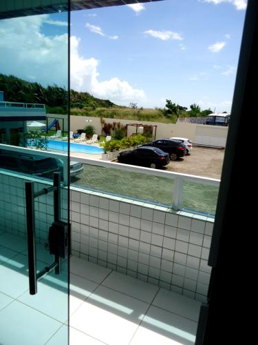 a view of a swimming pool from a window at Hotel Adventure São Luís in São Luís