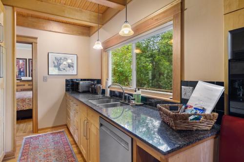a kitchen with a sink and a window at Geneva Retreat in Bellingham