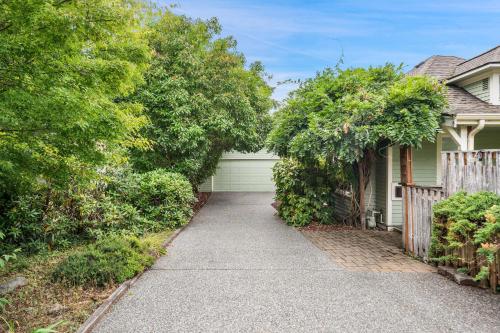 a driveway leading to a house with a fence at Geneva Retreat in Bellingham