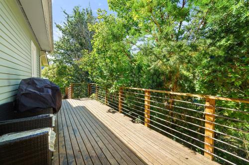 a wooden deck with a fence on the side of a house at Geneva Retreat in Bellingham