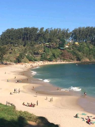 a group of people on a beach near the water at Studio Standard - AMI APPARTHOTEL in Tôlagnaro