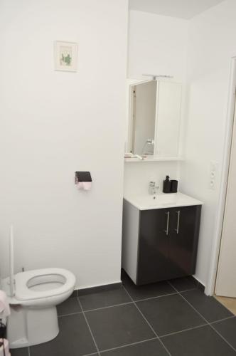 a bathroom with a toilet and a sink at Professional Studio Appartment in Bobigny
