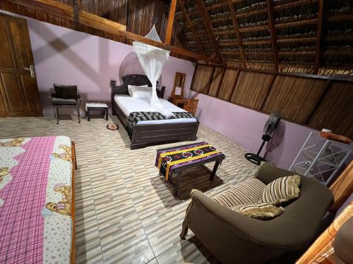 Postel nebo postele na pokoji v ubytování Lualemba Bungalow Resort