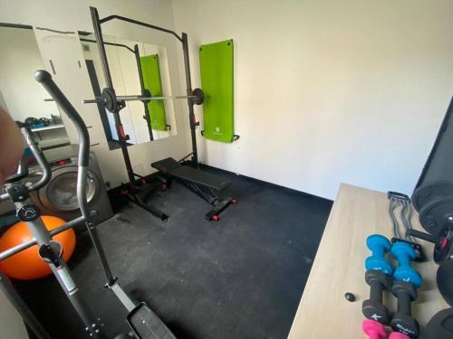 a gym with several exercise equipment in a room at Black Pearl V in Amiens