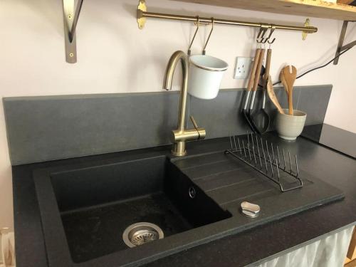 a kitchen counter with a sink and a sink at Beautiful, well positioned flat in Clifton Wood in Bristol