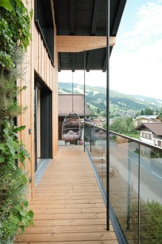 a view from the balcony of a house at Grand Pension Franziska - inkl CrossFit Gym in Saalbach Hinterglemm
