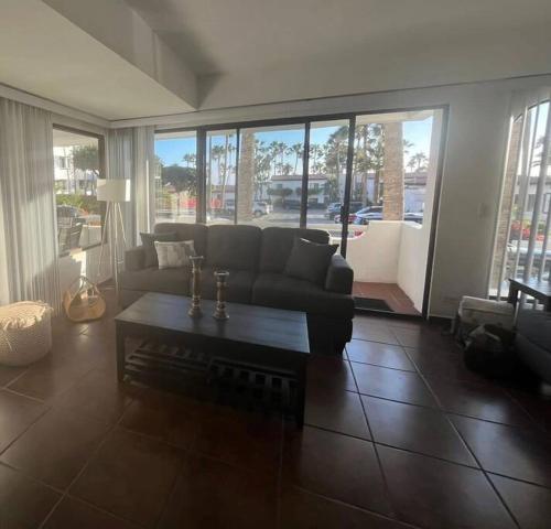 a living room with a couch and a coffee table at Your cozy home @Rosarito in Rosarito