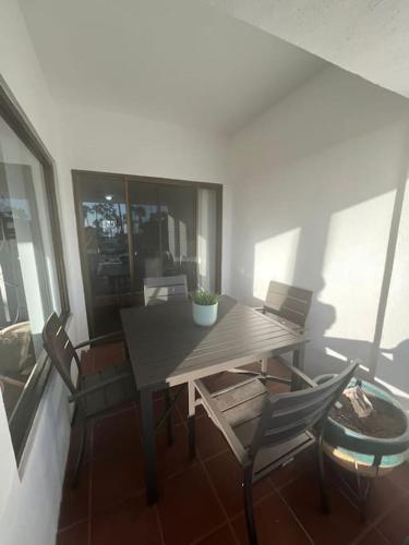 a dining room table and chairs in a room at Your cozy home @Rosarito in Rosarito