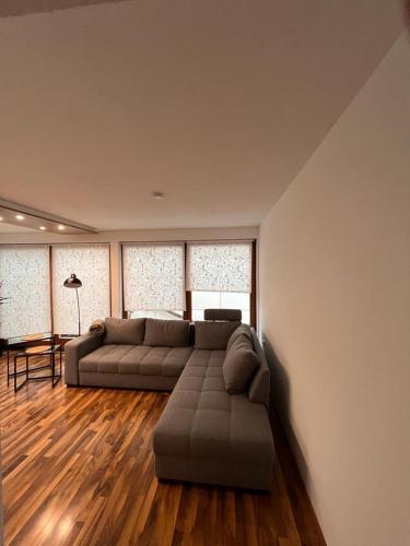 a large living room with two couches and a table at 4-h3rOeS Legoland Günzburg Wohnung 1 in Leipheim