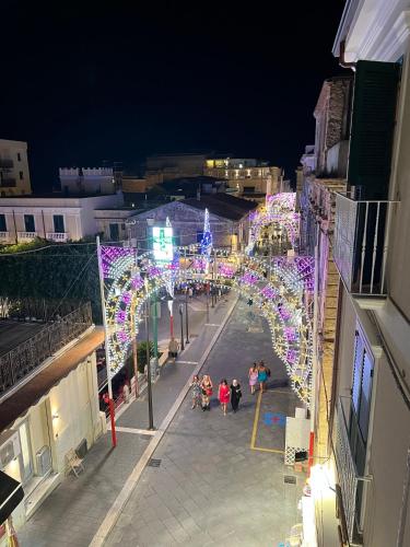 a street decorated with christmas lights at night at Don Carlo Tropea in Tropea