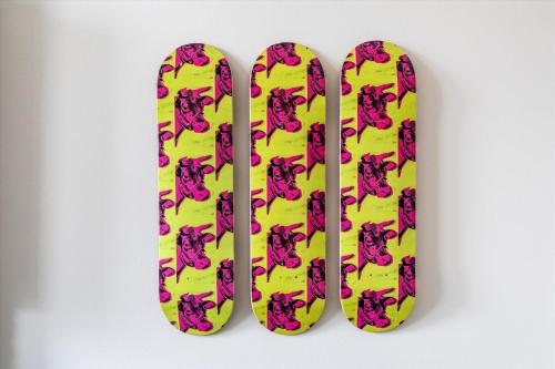 two pairs of snowboards on a white wall at The Lumber Baron's Mansion: 2 King Suites, 2.5BA + Gym in Detroit
