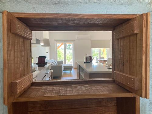 a view of a kitchen and a living room at Casa Ar da Beira - Serra da Estrela - Belmonte in Belmonte
