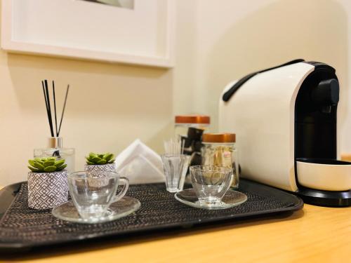 Kemudahan buat kopi dan teh di Quarto de hotel de luxo Congonhas